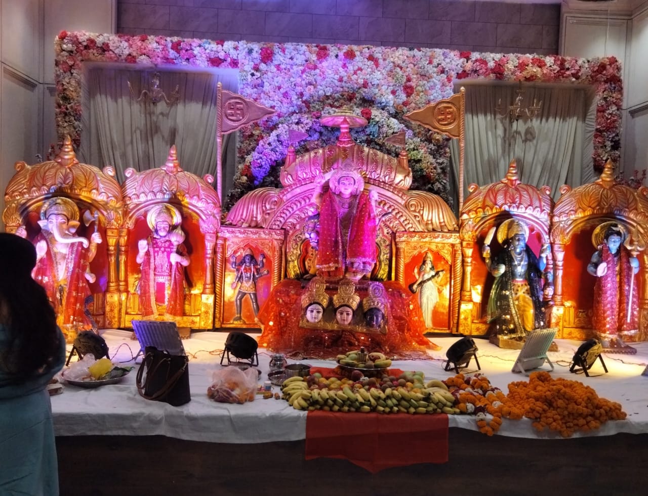 Stage lighting and decoration setup for a community jagran event